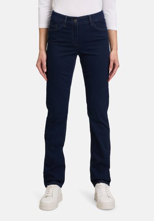 Jeans slim fit blu scuro realizzati in denim morbido, con tasche frontali, chiusura con bottone e sottili dettagli di cucitura.