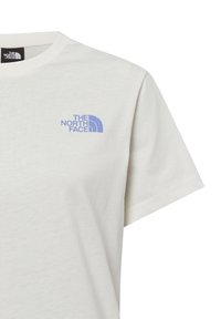 Lichtcrème katoenen T-shirt met korte mouwen en een blauw logo van "The North Face" op de linker borst.