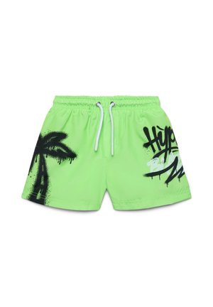 Costume da bagno verde neon con grafica di una palma nera e testo "Hyper" in bianco e nero. Dotato di una cintura elastica con coulisse.
