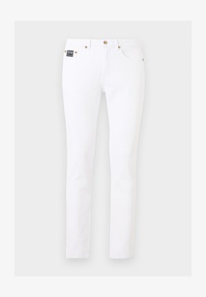 Jeans bianchi slim-fit con dettagli in oro su bottoni e rivetti, tasche frontali e piccolo patch nero con il marchio sul lato destro.