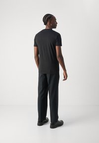 Calvin Klein Jeans SEASONAL MONOLOGO TEE - Marškinėliai su spaudiniu - black/pastel lilac