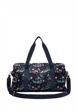 Floral duffel bag with a navy background, featuring a textured fabric, dual top handles, and a detachable shoulder strap. Gold-tone hardware accents.