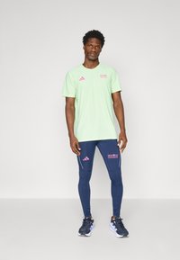 adidas Performance BER25 TEE - Sport T-Shirt - semi green spark