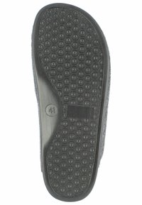 Zwarte schoenzool met een gestructureerd patroon van ronde indeukingen en een verhoging, gemarkeerd met maat 41. Glad rand.