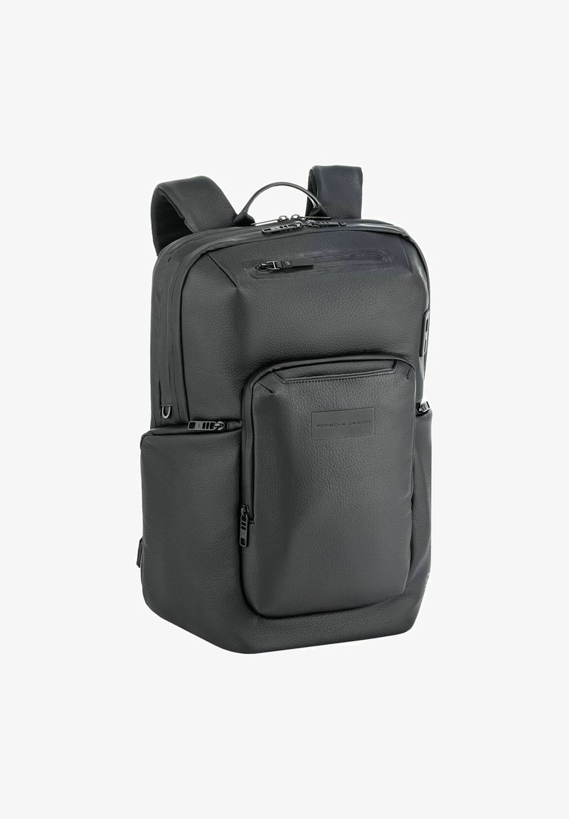 Sac à dos en cuir noir avec une finition texturée, comportant plusieurs compartiments zippés, des bretelles rembourrées et une poignée supérieure pour un transport facile.