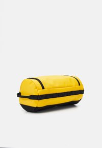 The North Face TRAVEL CANISTER  - Geantă cosmetice - gold-coloured/black