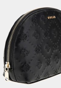 Black leather pouch with a textured pattern, featuring embossed designs and a gold zipper. Rounded shape with a smooth finish.