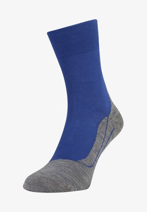 Calzino blu e grigio realizzato in misto cotone. Presenta un bordo a costine, tallone rinforzato e una texture liscia con un design a contrasto per la punta e il tallone.