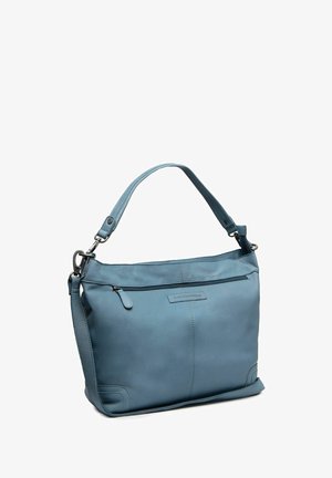 Sac à main en cuir bleu clair avec poignée supérieure, bandoulière amovible et poche zippée avant sur fond blanc.