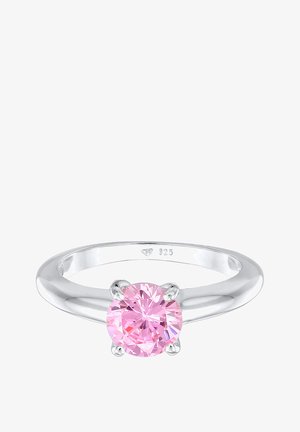 Silberring mit einem runden, pinken Edelstein, der in vier Krallen gefasst ist. Der Ringbarren ist glatt und poliert mit einer glänzenden Oberfläche. Innen mit "925" gestempelt.