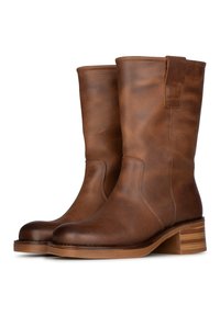 Braune Lederstiefel knöchelhoch mit glatter Oberfläche, runder Zehenform und niedrigem, gestapeltem Absatz; seitliche Zuglasche für einfaches Anziehen.