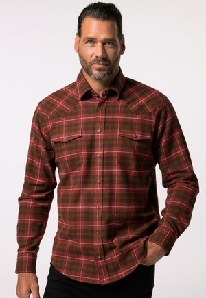 Camisa de cuadros roja y verde de botones, con dos bolsillos en el pecho, botones a presión y mangas largas. Fabricada en tejido texturizado.