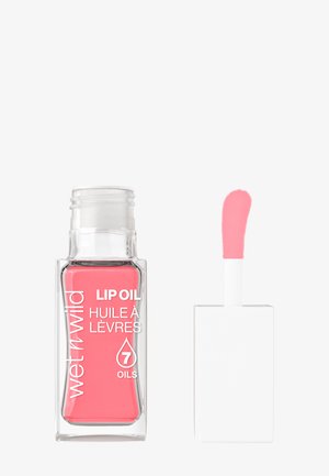 Flacon en verre transparent avec de l'huile à lèvres rose, étiquette blanche en texte, bouchon blanc carré. Livré avec un applicateur rose.