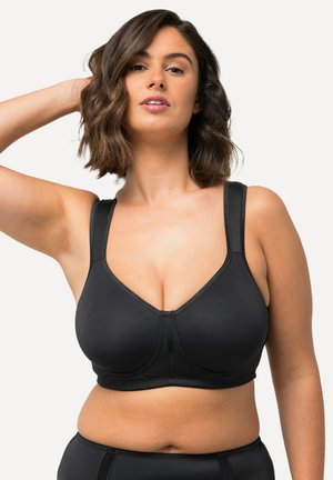 Sostenedor negro con tirantes anchos, textura suave y escote pronunciado. Diseñado para mayor comodidad con un ajuste sin costuras y de soporte.