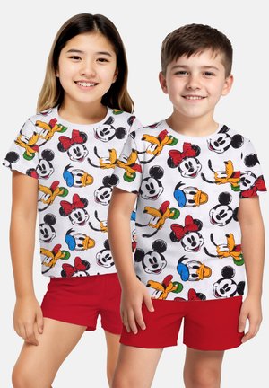 White cotton t-shirts featuring a colorful print of cartoon characters Mickey, Minnie, Donald, and Goofy, paired with red shorts.