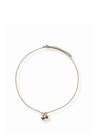 Delicate gold chain necklace with two small charms: a star-shaped green charm and a round red charm, on a white background.