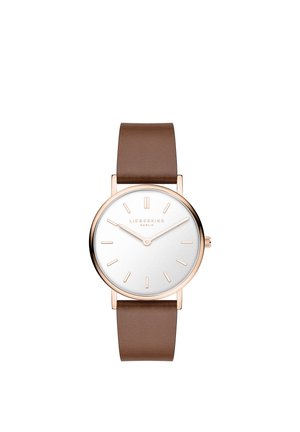 Braune Lederarmbanduhr mit rundem weißem Zifferblatt, roségoldener Lünette, minimalistischen goldenen Stundenmarkierungen und zwei Zeigern, die 10:09 anzeigen.