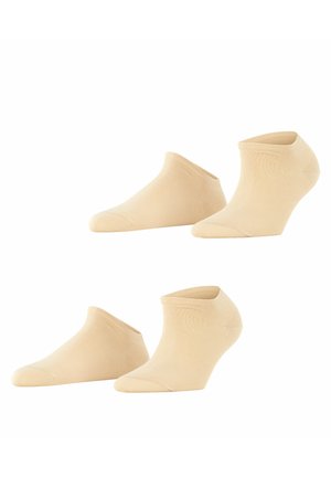 Chaussettes beige jusqu'à la cheville avec une texture lisse et côtelée. Dotées d'un design à coupe basse et d'un orteil renforcé. Idéal pour un port discret avec des chaussures.