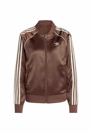 Giacca bomber in raso marrone con strisce bianche lungo le maniche, chiusura con zip, tasche laterali e un piccolo logo sul petto.