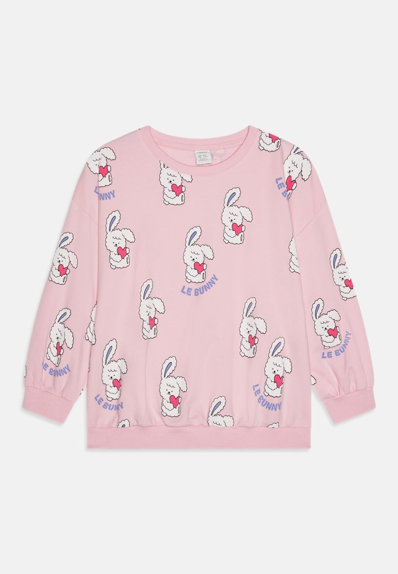 Pink long-sleeve sweatshirt featuring a repeating rabbit pattern holding a heart. Accented with "LE BUNNY" text in blue. Soft fabric, casual fit.