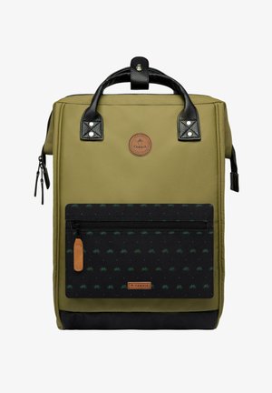 Green canvas backpack with black leather accents, rectangular shape, front zip pocket featuring small green bicycle patterns, and a logo patch.