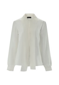 Blusa bianca in tessuto morbido, con colletto a punta, maniche lunghe con dettagli ai polsini e una decorazione a nodo frontale.