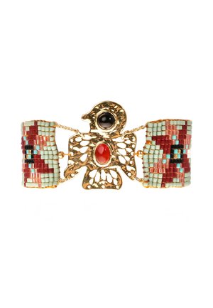 Gold-toned bird-shaped brooch with black and red stones, connected to beadwork bands in mint green, red, and black geometric patterns.