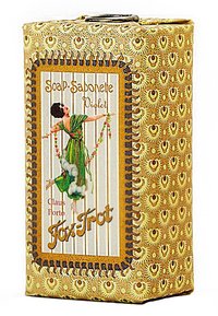 Violette Seifenverpackung mit einem dekorativen gold- und braunfarbenen Muster. Enthält eine Darstellung einer Figur in Grün, die Blumen hält und von Wolken umgeben ist.