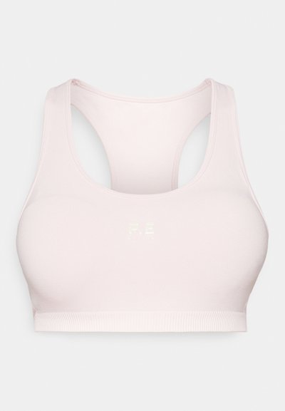Top desportivo rosa claro com decote redondo e design às costas em forma de corrida. Apresenta um material suave e elástico, e um logótipo discreto na parte frontal.