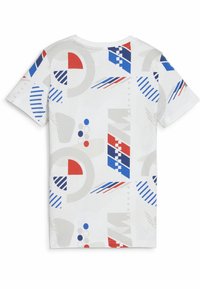 White t-shirt featuring an abstract geometric pattern in red, blue, and gray. Short sleeves, crew neck, lightweight cotton material.