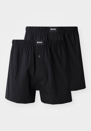 Black boxer shorts in a pack of two, featuring an elastic waistband, button fly, and logo label. Smooth cotton fabric with a classic cut.