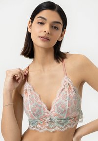 Lace bralette in pastel pink and mint with floral embroidery, triangular cups, adjustable straps, and scalloped lace trim.