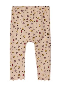 Beige legging met een zachte textuur, voorzien van een speels patroon van gele, roze en rode harten en ovale vormen. Geribbeld detail bij de enkel.