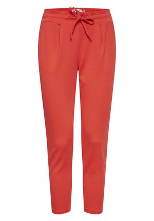 Red jogger pants made of soft fabric, featuring an elastic waistband with a drawstring and two side pockets. Straight leg design.
