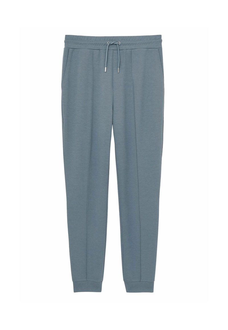 Pantaloni de jogging de culoare albastru deschis, confecționați dintr-un material moale, având un elastic în talie cu șnur, buzunare laterale și manșete tapered.
