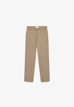 Beige elastične hlače s elastičnim pasom in vrvico, s pridobljenima dvema stranskima žepoma in ravno obliko nogavic. Gladko teksturo.