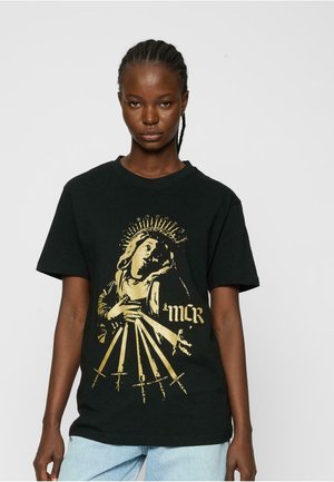 Black cotton t-shirt featuring a gold graphic print of a figure holding swords, with "MCR" text, relaxed fit and short sleeves.