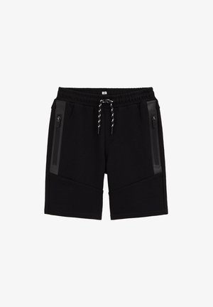 Mustad põlveni ulatuvad lühikesed püksid elastse vöökohaga, musta ja valge paelaga ning vertikaalsete tõmblukuga taskutega, tumeda äärisega mõlemal küljel.