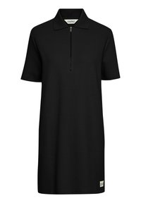 Crna pamučna haljina polo s kratkim rukavima, teksturirana tkanina, polu-zip prednji dio i mala oznaka s logotipom sa strane. Jednostavan, ravni dizajn.