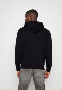 Calvin Klein Jeans SEASONAL MONOLOGO REGULAR HOODIE - Camisola - black