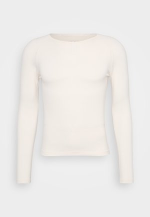 Langetermijn overhemd in off-white, met een ronde halslijn en een slim fit. Gemaakt van zachte, lichtgewicht stof zonder patronen of versieringen.