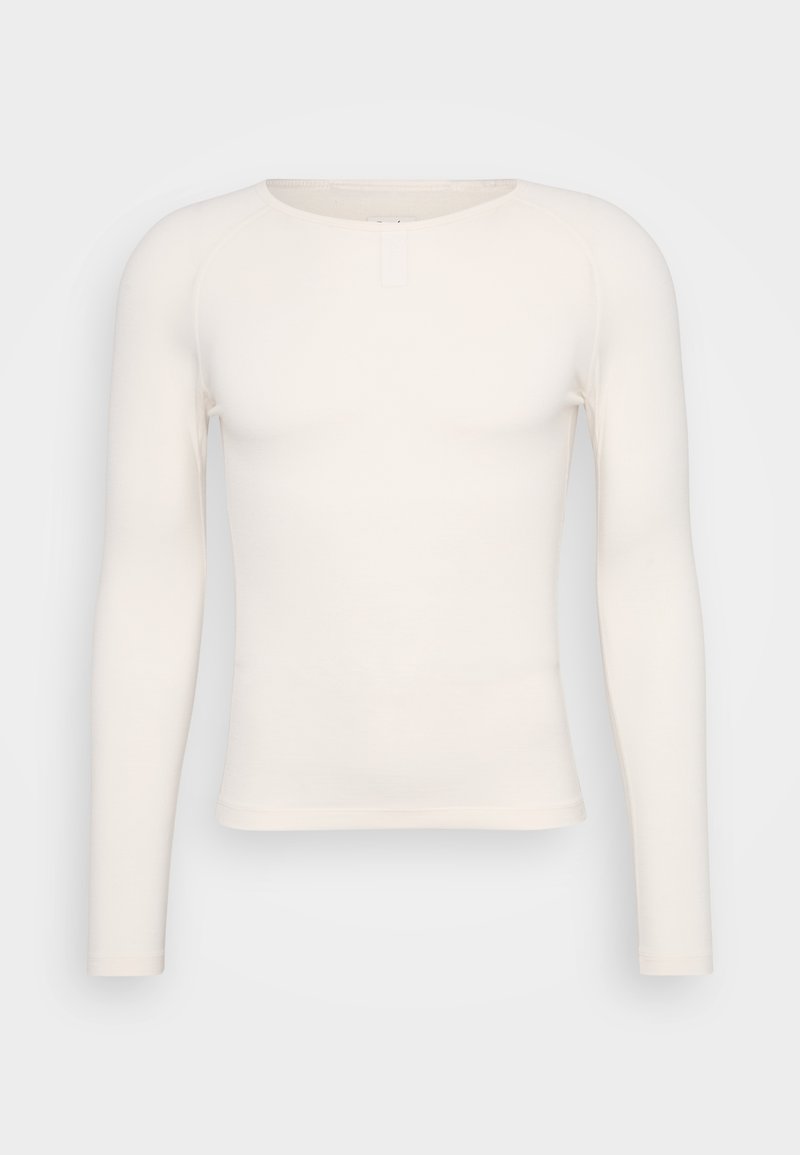 Camicia a maniche lunghe in bianco sporco, con scollatura rotonda e vestibilità aderente. Realizzata in un tessuto morbido e leggero, priva di fantasie o decorazioni.