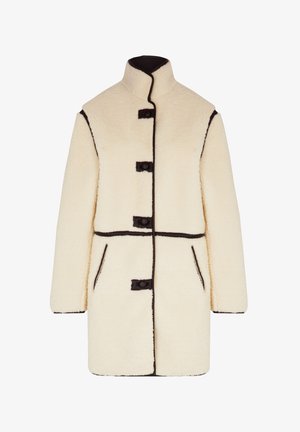 Cremefarbener Fleece-Mantel mit hohem Kragen, schwarzem Besatz, drei schwarzen Knöpfen und zwei Seitentaschen. Weicher Stoff, gradliniger Schnitt.