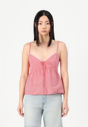 Rot-weißer, kariierter Peplum-Top mit dünnen Trägern, V-Ausschnitt und einem zentralen Bindedetail. Leichter Stoff mit gerafftem Taillenbund.