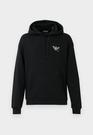 Black hooded sweatshirt with front pocket and small stylized eagle logo on the left chest, featuring drawstrings at the hood.