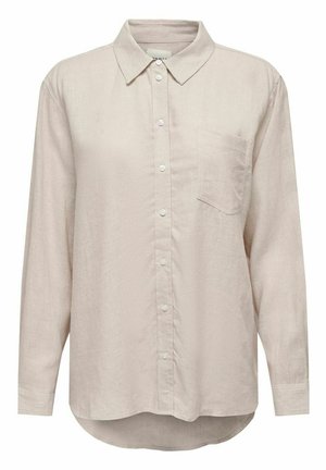 Chemise beige clair à manches longues avec boutons, col et poche poitrine, avec un ourlet légèrement arrondi et des boutons blancs simples.