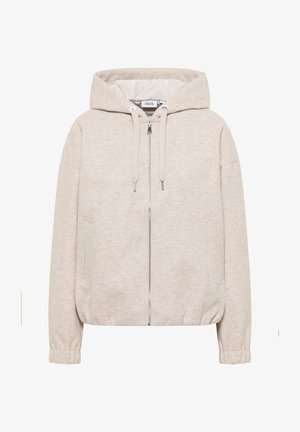 Jasno beżowa kurtka z kapturem, zapinana na zamek, z elastycznymi mankietami i bocznymi kieszeniami. Wykonana z miękkiego, teksturowanego materiału.