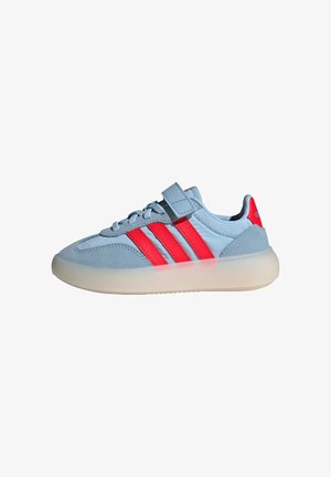 Light blue sneaker with red stripes, suede and synthetic upper, textured rubber sole, lace and Velcro closure, rounded toe design.