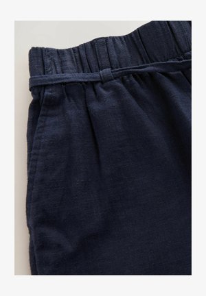 Marineblå linnedbukser med elastisk talje og subtil struktur, med indsamlede detaljer ved taljen og sidesømme.