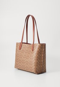Brown patterned tote bag with smooth leather handles, rectangular shape, and open top design. Features a subtle logo print on the fabric.